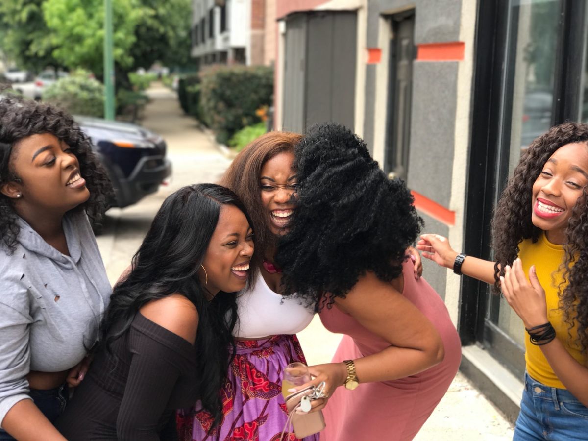 Group of friends laughing together on a trip